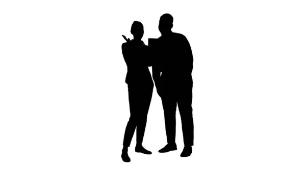 Silhouette Young caucasian businesswoman and her african colleague making video call with tablet. — Stock Photo, Image