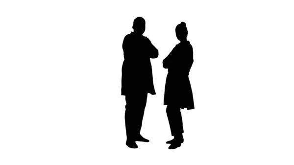 Silhouette Woman and man doctors with crossed arms. — Stock Photo, Image