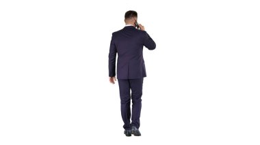 Walking business man with talking on mobile phone on white background. clipart