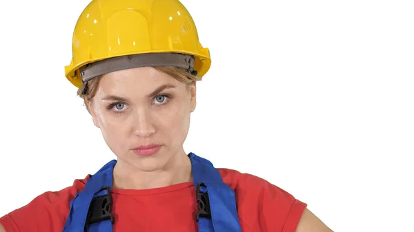 Stolt säker ung kvinna arbetare med armar på höfter på vit bakgrund. — Stockfoto