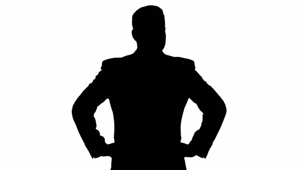 Silhouette Uomo d'affari guardarsi intorno con le mani sui fianchi. — Foto Stock