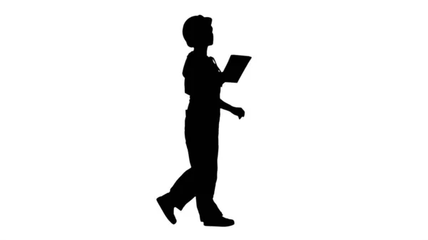 Silhouet Bouw dame met elektronische tablet lopen. — Stockfoto
