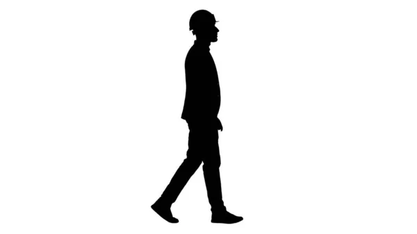 하얀 헬멧을 쓴 실루엣 건축가걷기. — 스톡 사진