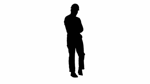 Silhouette Workman with helmet walking in a funny way and laughing. — Stock Photo, Image