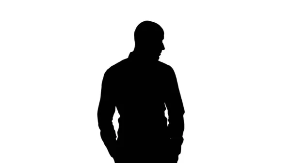 Silhouette Arab in casual looking around with hands in pockets. — Stock Photo, Image