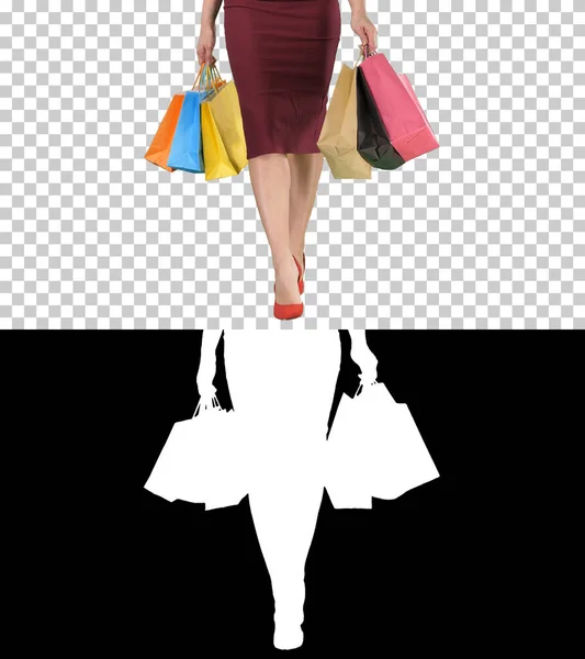 Lets go shopping Beautiful woman legs with shopping bags walking, Alpha Channel