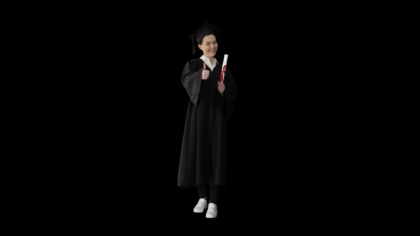 Mujer graduada feliz sosteniendo diploma y pulgar hacia arriba, Alpha Channel — Vídeo de stock