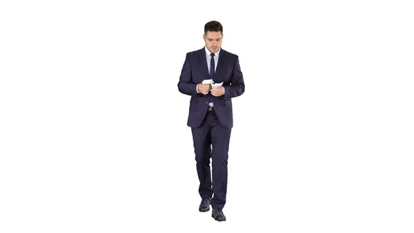 Man in suit walking and counting money on white background. — Stock Photo, Image