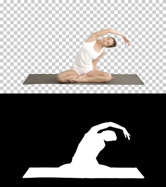 Gyönyörű nő gyakorolja jóga lótuszban pózol nyújtás, kéz abo — Stock Fotó