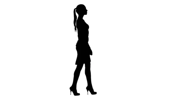 Silhouette Giovane donna d'affari sta camminando. — Foto Stock