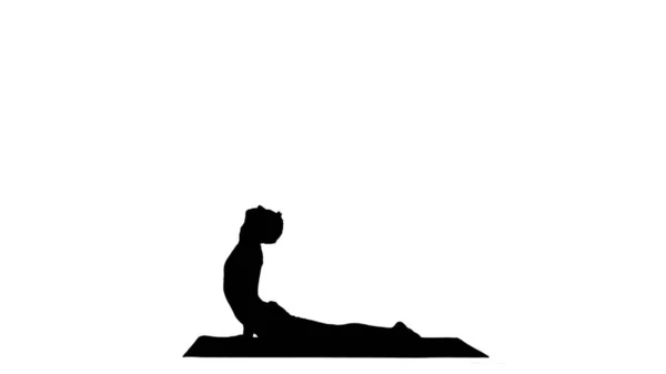 Silhouette Man macht Yoga-Posen. — Stockfoto