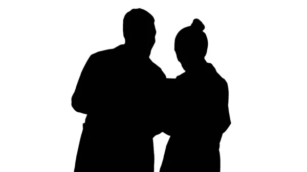 Silhouette Young female doctor and afro american doctor looking — Stock Photo, Image