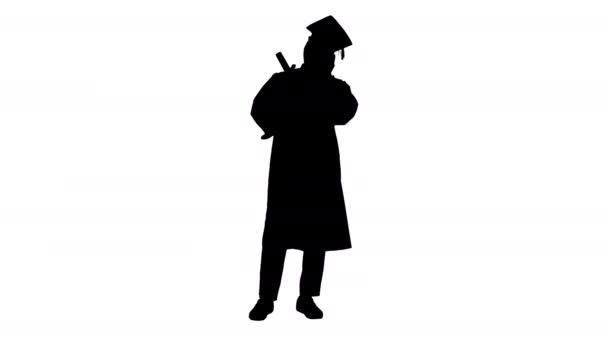 Silhouette Smiling african american male student in graduation robe talking on the phone sharing happy news. — Stock Video