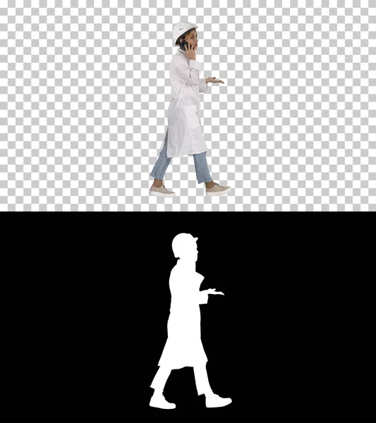 Female scientist making a call walking, Alpha Channel — Stock Photo, Image