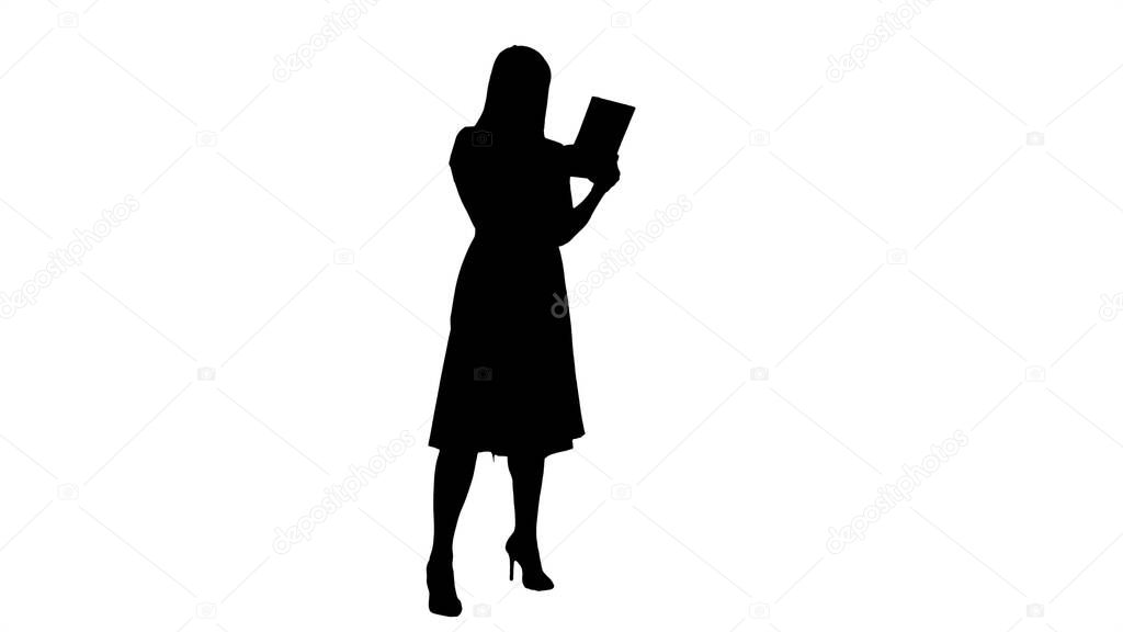 Silhouette Single girl making a video call on her tablet side vi