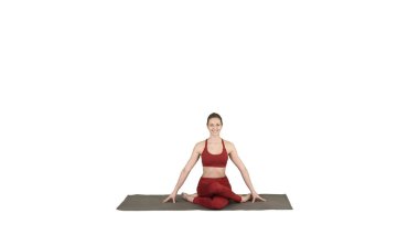 Genç çekici kadın yoga yapıyor, Gomukasana 'da oturuyor.