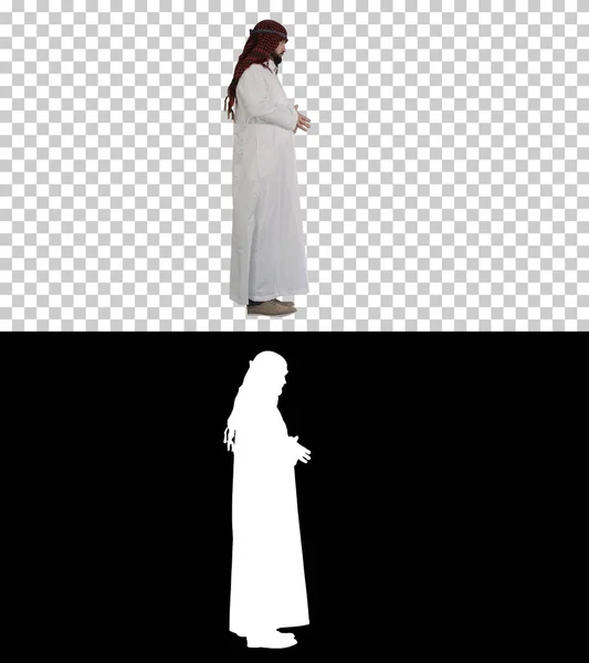 Xeque árabe vestindo keffiyeh de pé, Canal Alpha com Silhou — Fotografia de Stock