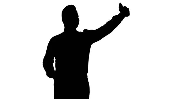 Silhouette Hombre guapo tomando una selfie. Selfie rápido. —  Fotos de Stock