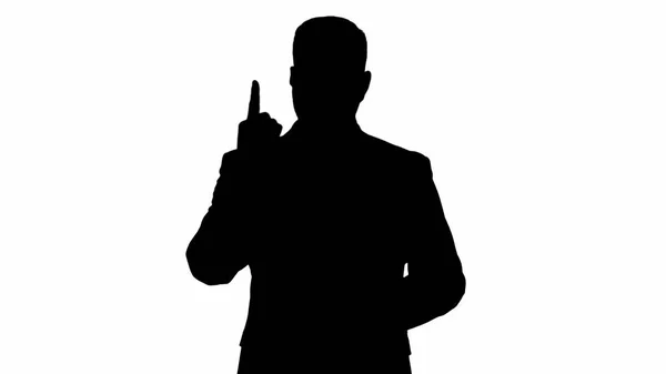 Silhouette Homme d'affaires pointant le doigt vers le haut faisant un accent. — Photo
