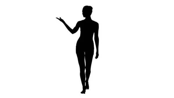 Silhouette Giovane donna bionda che cammina e indica showi laterale — Foto Stock