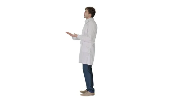 Doctor wearing white coat explaining something on white backgrou — Stock Photo, Image