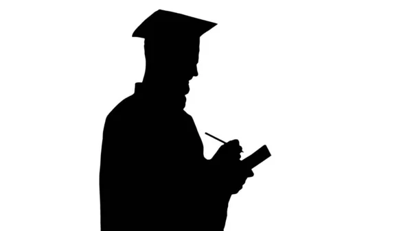 Thoughtful graduation man writing down his goals, Alpha Channel — Stock Photo, Image