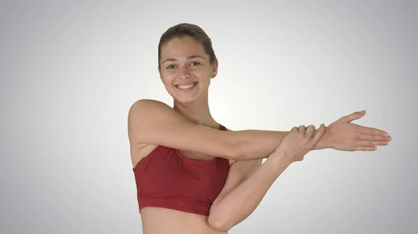 Haciendo ejercicios de estiramiento Hermosa joven haciendo stretchin —  Fotos de Stock