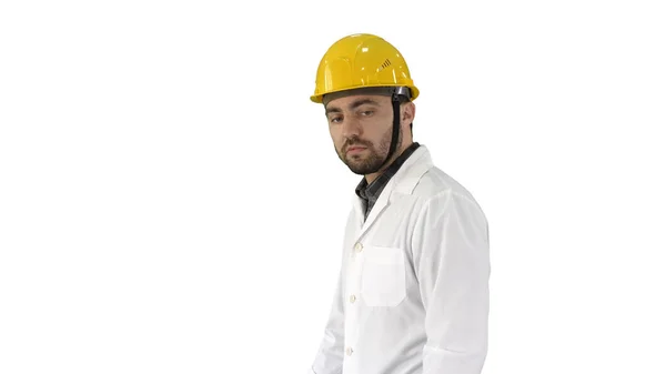 Unhappy construction site engineer talking and walking on white — Stock Photo, Image