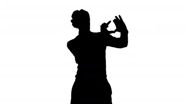 Silhouette Funny mime in white gloves making selfie photos. — Stock Video