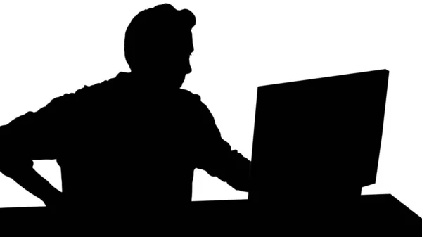 Silhouette Nervöser Mann, der Videospiele auf einem PC-Computer anschaut. — Stockfoto