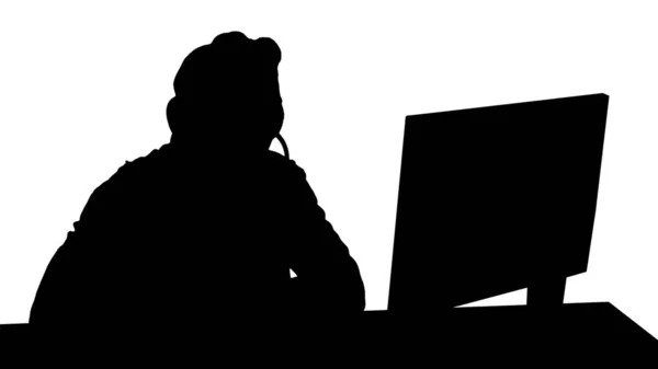 Silhouette Junger Mann mit Videotelefonie am PC. — Stockfoto