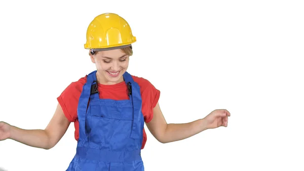 Mujer en casco de construcción bailando sobre fondo blanco. — Foto de Stock