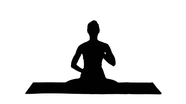 Silhouette Yoga Girl atmet in Lotus-Pose mit den Händen auf dem Kopf — Stockfoto