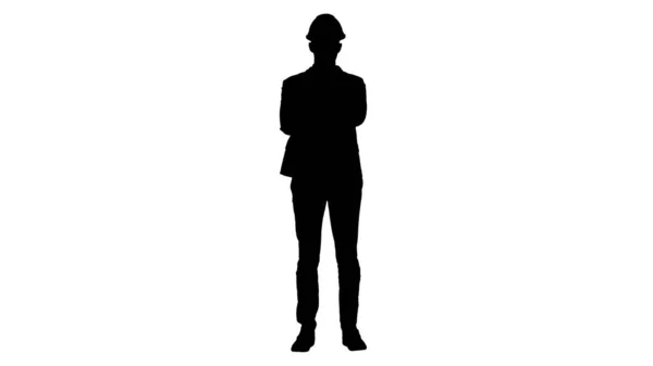 Silhouette Confident construction engineer architect young man in helmet with hands folded. — Stock Photo, Image