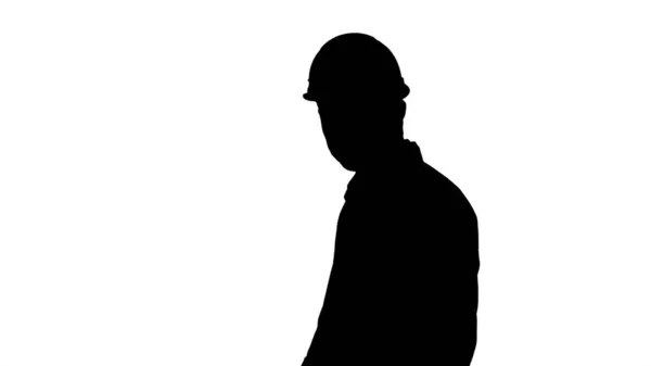 Silhouette Ingénieur de chantier malheureux parlant et marchant — Photo