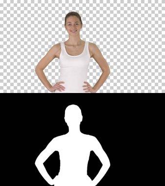 Spor kıyafetleri içinde kendinden emin, aktif, sağlıklı bir kadın.