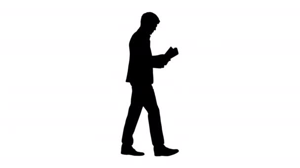 Silhouette Concentrated Businessman reading documents or report while walking. — Stock Video