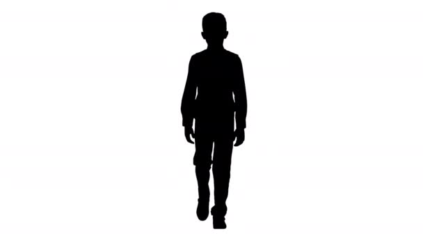 Silhouette Little boy in a waistcoat and a bow tie walking looking straight ahead. — Stock Video