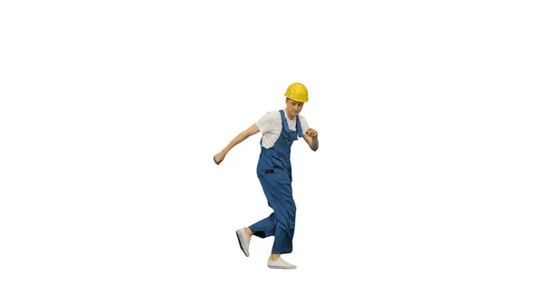 Young construction worker in yellow hardhat break dancing lookin — Stock Photo, Image