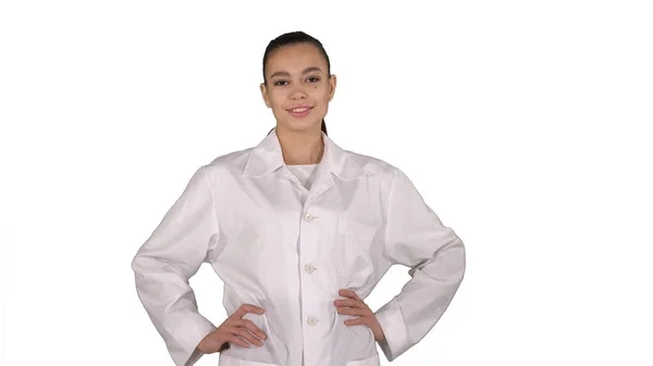 Woman doctor walking like fashion model on white background. — Stock Photo, Image