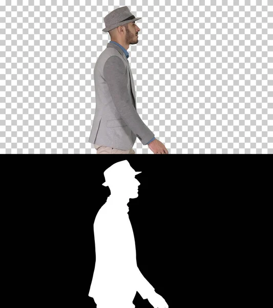 Hombre árabe casual en sombrero caminando, canal alfa —  Fotos de Stock
