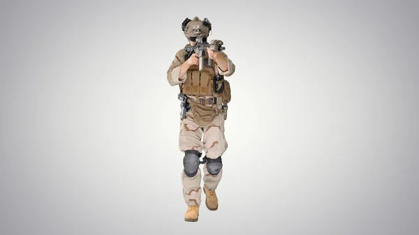 Soldier of special force walking and shooting with a rifle on gr — Stock Photo, Image