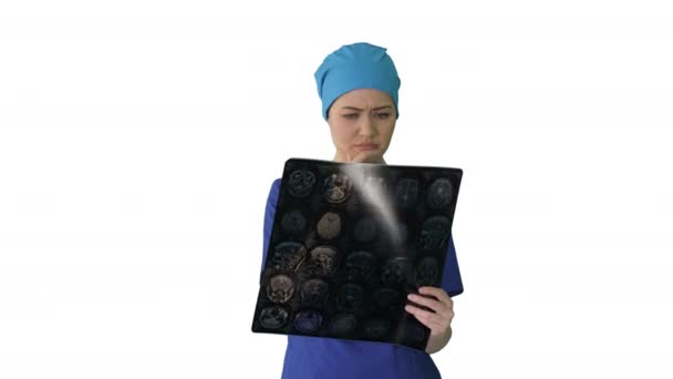 Female doctor looking at brain tomography on white background. — Stock Video