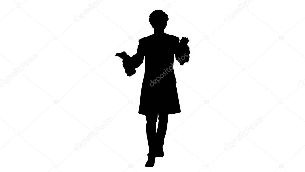 Silhouette Man dressed like Mozart conducting while walking.