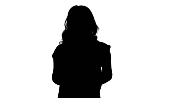 Silhouette Fiatal csinos nő alkalmi pólóban háttal — Stock Fotó