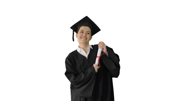 Happy female student in graduation robe walking and cheering wit — Stock Photo, Image