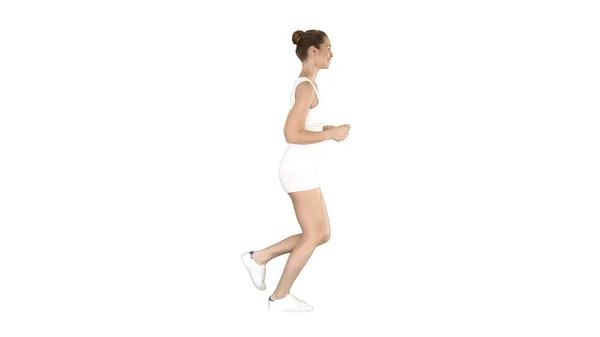 Sportliche Frau läuft auf weißem Hintergrund. — Stockfoto
