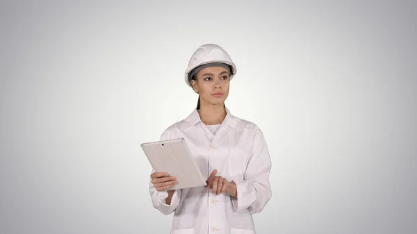 Woman engineer checking information and objects on her tablet on — Stock Photo, Image