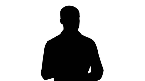 Silhouette arabischer junger Mann im Hemd, der etwas präsentiert und zur Seite zeigt. — Stockfoto