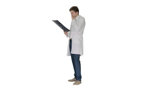 Concentrated male doctor looking at computed tomography xray ima — Stock Photo, Image